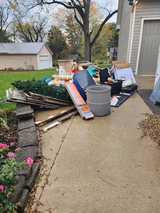 Dumpster being loaded with debris for 3 Yard Dumpster Rental in Inverness